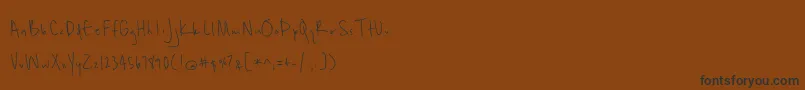 Unrulyness Font – Black Fonts on Brown Background