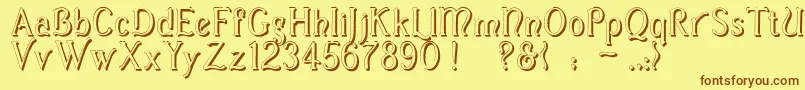 フォントCasuaShadow – 茶色の文字が黄色の背景にあります。