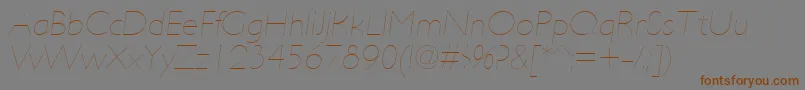 Fonte UltimapdabHairlineitalic – fontes marrons em um fundo cinza