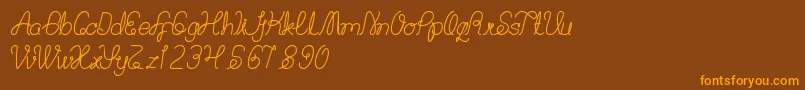 BillyJean Font – Orange Fonts on Brown Background