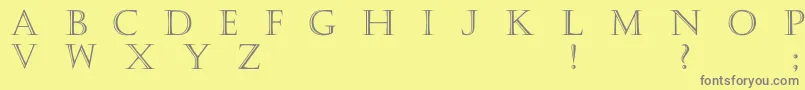 Haute-fontti – harmaat kirjasimet keltaisella taustalla
