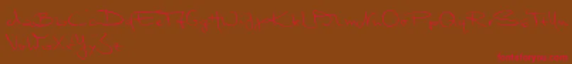 MarleenScriptNormalReduced-Schriftart – Rote Schriften auf braunem Hintergrund