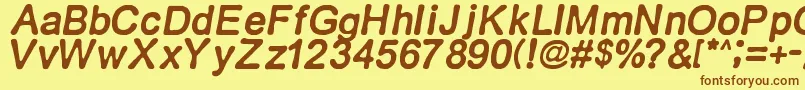 フォントRetroitalics – 茶色の文字が黄色の背景にあります。