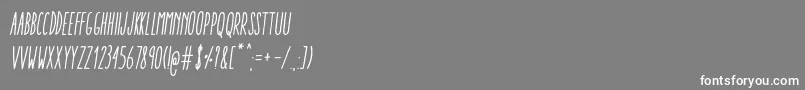 AracneUltraCondensedRegularItalic Font – White Fonts on Gray Background