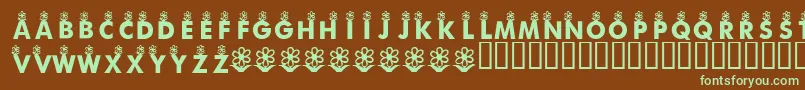 フォントKrFirstBloom – 緑色の文字が茶色の背景にあります。