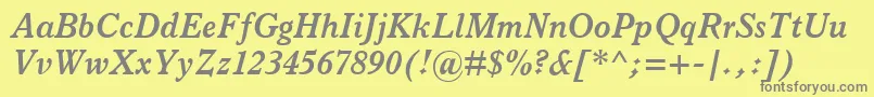 ItalianOldStyleMtBoldItalic-fontti – harmaat kirjasimet keltaisella taustalla