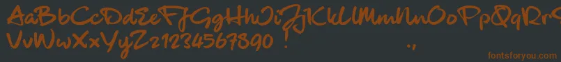 Fonte BlackhandTrial – fontes marrons em um fundo preto