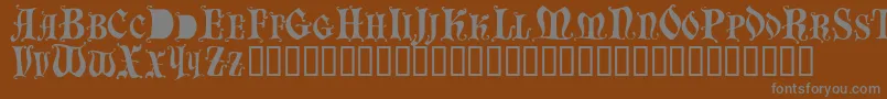 Шрифт Bastognescapsssk – серые шрифты на коричневом фоне
