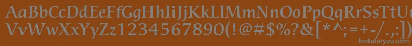 CerigostdMedium-fontti – harmaat kirjasimet ruskealla taustalla