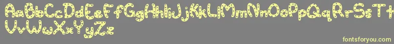Watertoy Font – Yellow Fonts on Gray Background