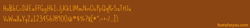 AlphabetizedCassetteTapesThin Font – Orange Fonts on Brown Background