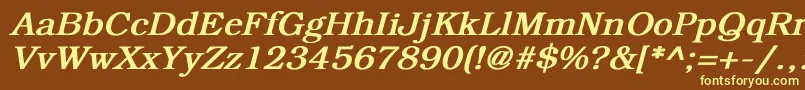 BookmanBoldItalic-fontti – keltaiset fontit ruskealla taustalla