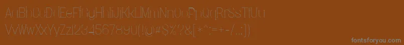 Шрифт Vacerserifthinpersonal – серые шрифты на коричневом фоне