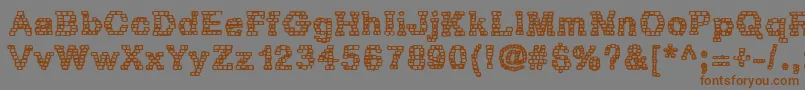 フォントRhBrickhausProtoZoa – 茶色の文字が灰色の背景にあります。