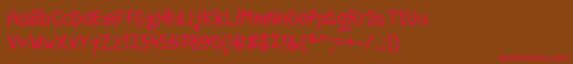 フォントDccMarkerQuick – 赤い文字が茶色の背景にあります。