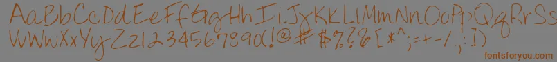 フォントLindyRegular – 茶色の文字が灰色の背景にあります。
