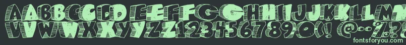 Caveman ffy Font – Green Fonts on Black Background