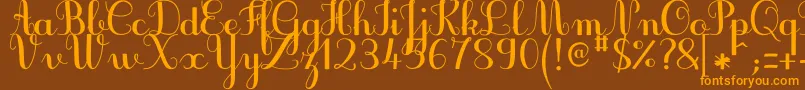 フォントJbcursiveV3Bold – オレンジ色の文字が茶色の背景にあります。