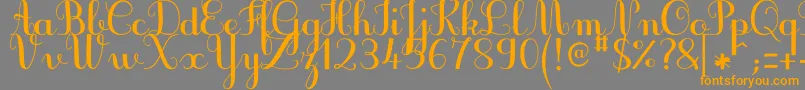 フォントJbcursiveV3Bold – オレンジの文字は灰色の背景にあります。