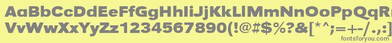 UrwgrotesktextwidBold-fontti – harmaat kirjasimet keltaisella taustalla