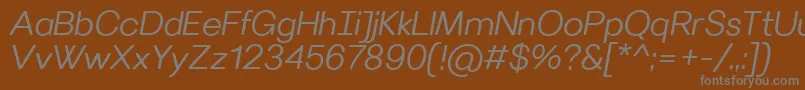 VillerayroundedSemilightitalic-fontti – harmaat kirjasimet ruskealla taustalla