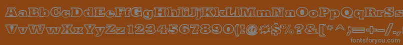 NacimientoExtrabold-fontti – harmaat kirjasimet ruskealla taustalla