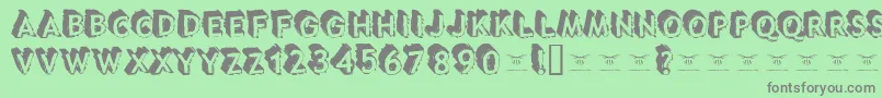 Tacotruckmilitia Font – Gray Fonts on Green Background