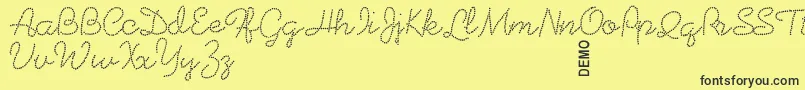 Beadworkdemo-Schriftart – Schwarze Schriften auf gelbem Hintergrund