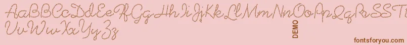 Weitere Informationen zur Beadworkdemo-Schriftart Beadworkdemo-Schriftart – Braune Schriften auf rosa Hintergrund