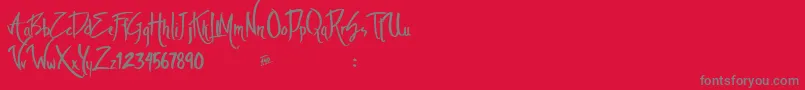 Theambiencedemo-fontti – harmaat kirjasimet punaisella taustalla