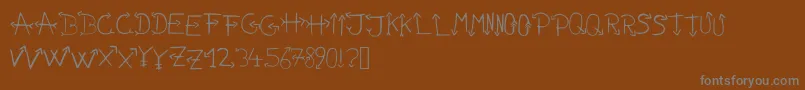 Nonamefont Font – Gray Fonts on Brown Background