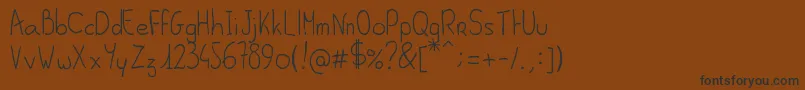 AlSeana Font – Black Fonts on Brown Background