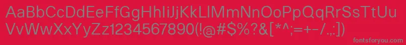 HeltarRegular-fontti – harmaat kirjasimet punaisella taustalla