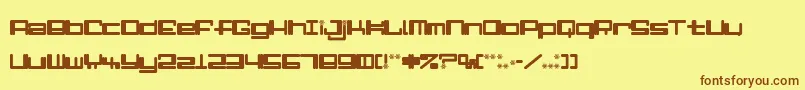 フォントAlphaNiner – 茶色の文字が黄色の背景にあります。