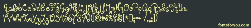 フォントJandles – 黒い背景に黄色の文字