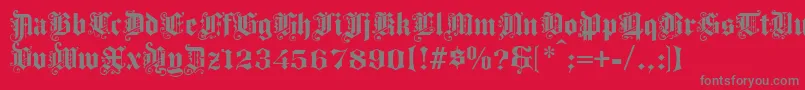フォントProgressivetext – 赤い背景に灰色の文字