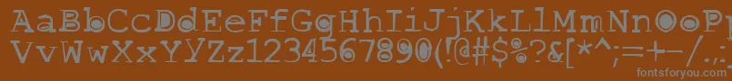 Buttlint-fontti – harmaat kirjasimet ruskealla taustalla
