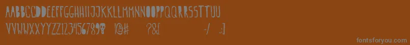 Шрифт Gogozombie – серые шрифты на коричневом фоне