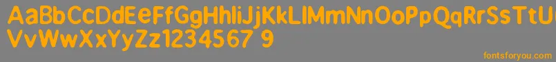 フォントBeppofet – オレンジの文字は灰色の背景にあります。