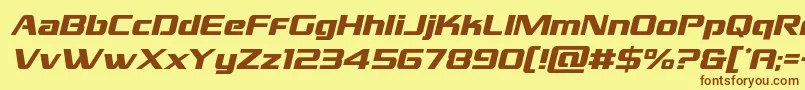 フォントGrandnationalital – 茶色の文字が黄色の背景にあります。