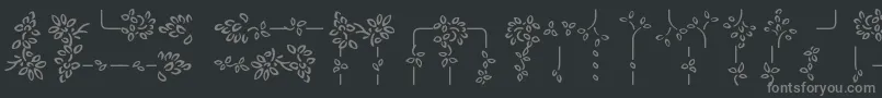 Lisätietoja AuriolVignette-fontista AuriolVignette-fontti – harmaat kirjasimet mustalla taustalla