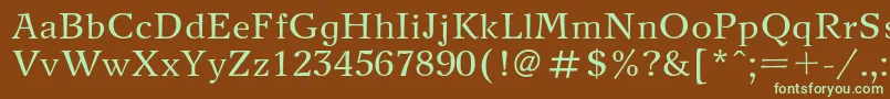 フォントNewjournalc – 緑色の文字が茶色の背景にあります。