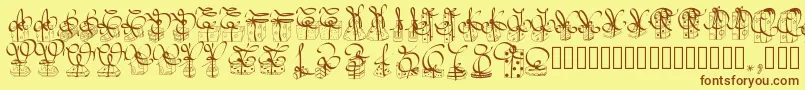 フォントPwchristmasgifts – 茶色の文字が黄色の背景にあります。