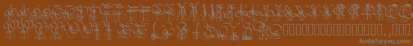 Pwchristmasgifts-fontti – harmaat kirjasimet ruskealla taustalla