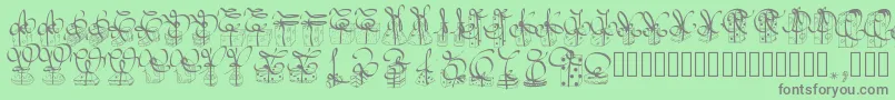 フォントPwchristmasgifts – 緑の背景に灰色の文字