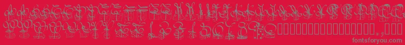 Pwchristmasgifts-fontti – harmaat kirjasimet punaisella taustalla