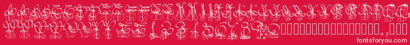Pwchristmasgifts-fontti – vaaleanpunaiset fontit punaisella taustalla