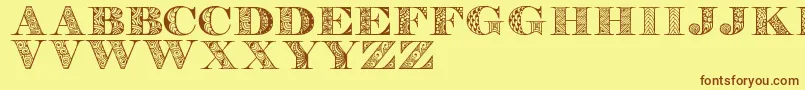 フォントDigizenpersonaluse – 茶色の文字が黄色の背景にあります。