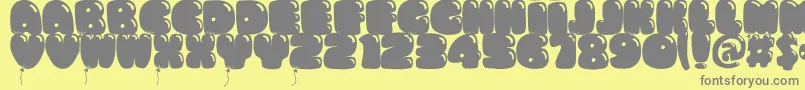 フォントBumbazo – 黄色の背景に灰色の文字
