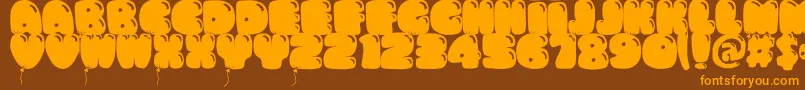 Fonte Bumbazo – fontes laranjas em um fundo marrom